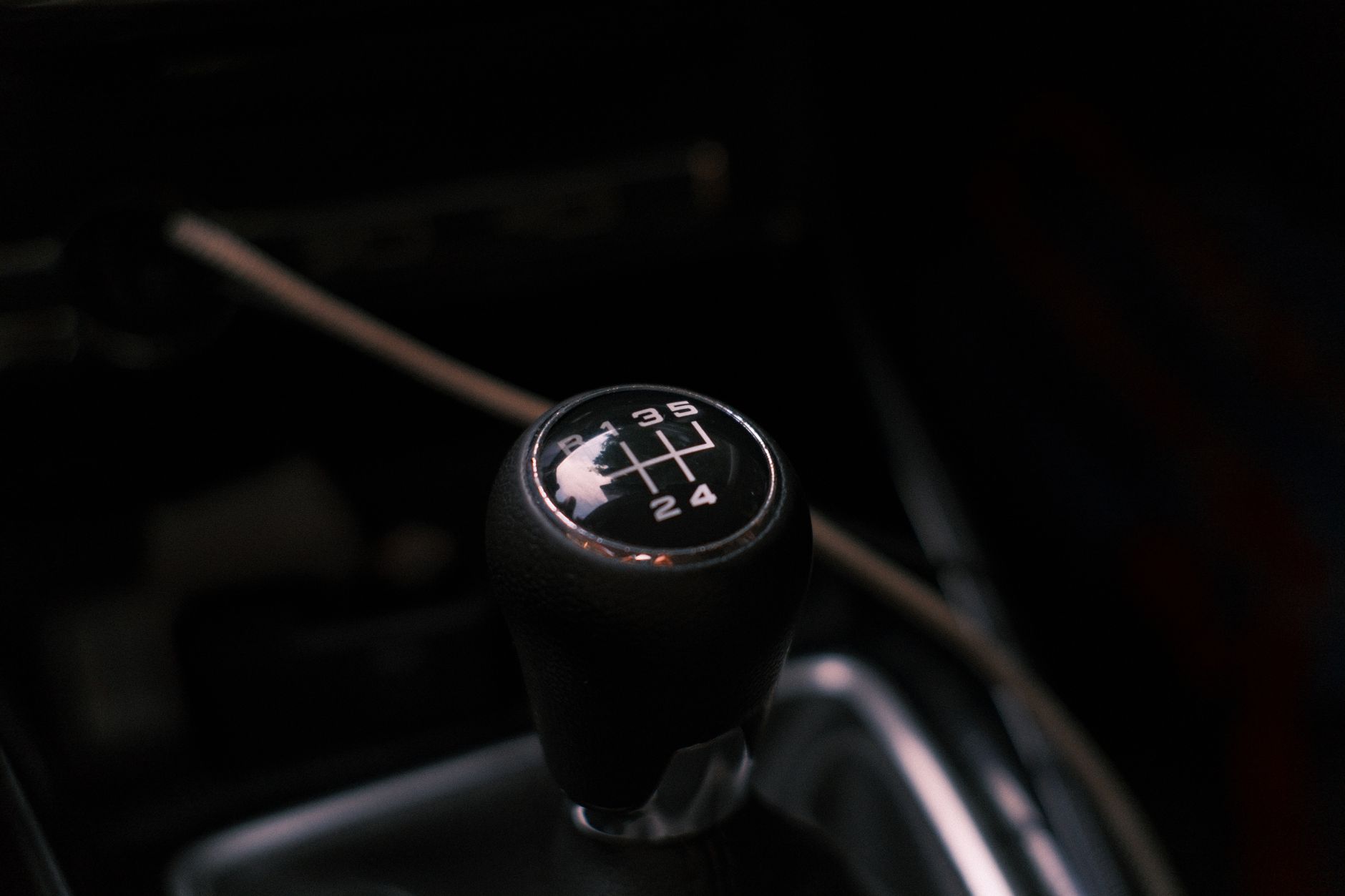 A manual car gear stick, the control an automatic learner never has to think about