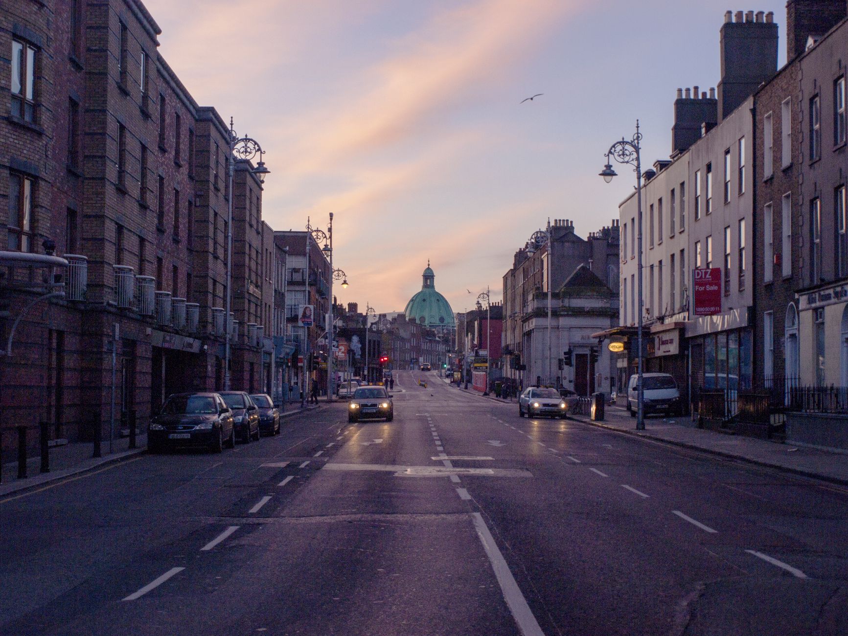 A Dublin road at dusk with traffic, the kind of road learner hours are spent on