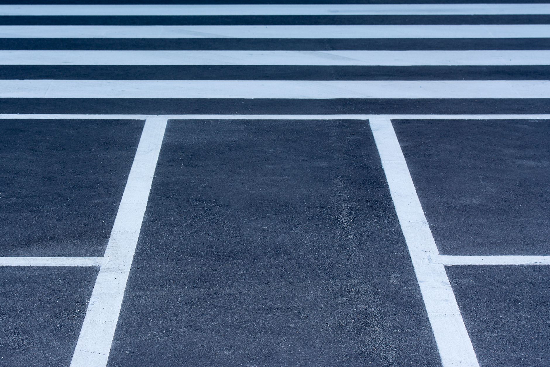 Painted lane markings and arrows on an approach to a junction