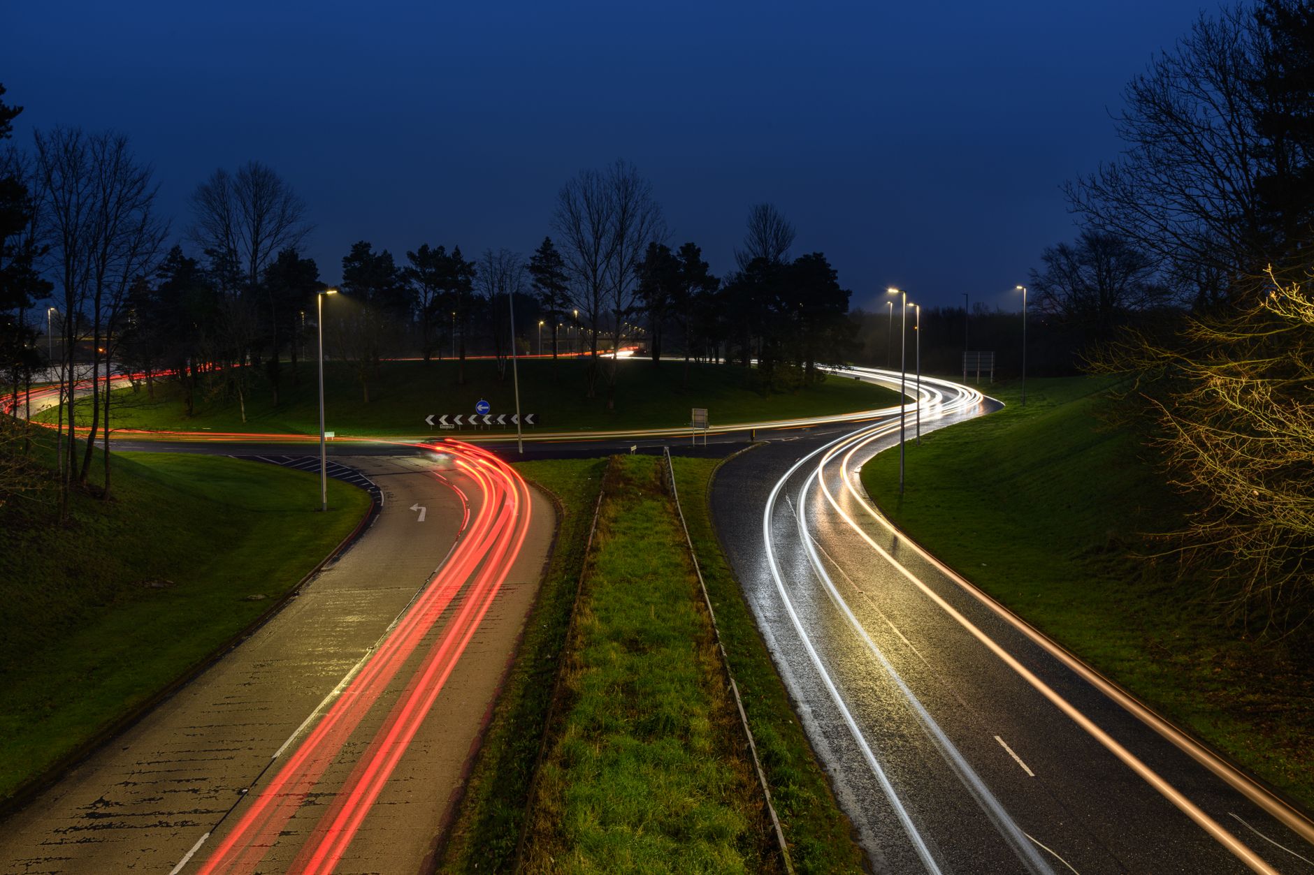 Traffic moving through a busy multi-lane roundabout